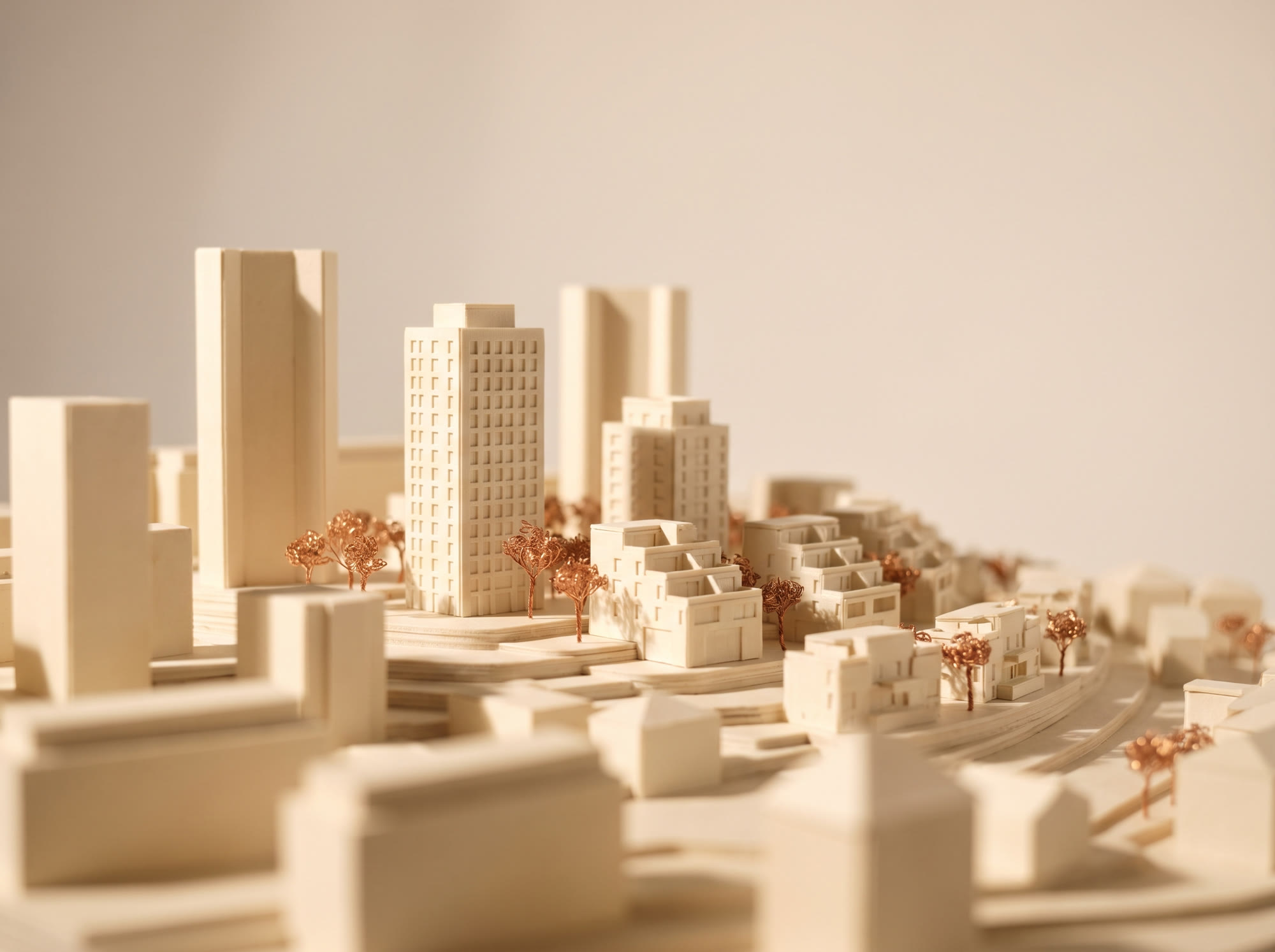Macro photograph of an ivory architectural scale model of a master community